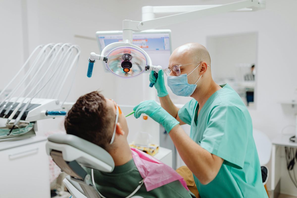 Dentist examining patient in modern dental clinic